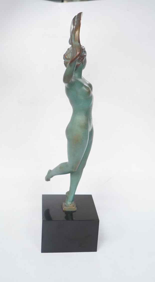 A French Art Deco bronze model of a dancer, green patination, on black marble base. 33cm high. Condition - minor chip to base